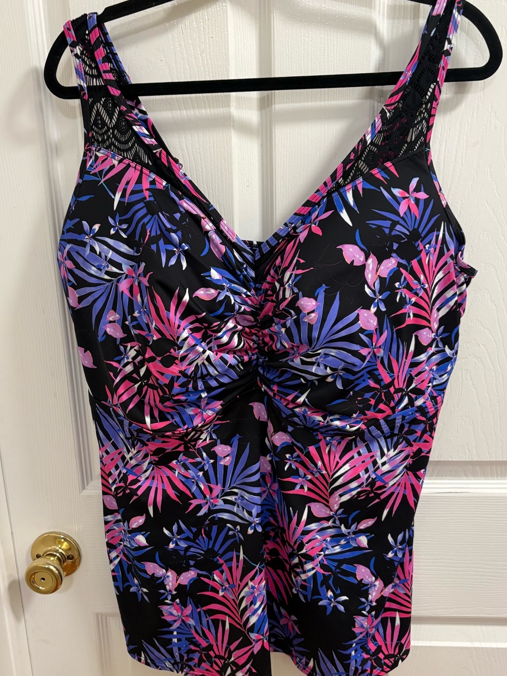 Swimsuits For All Crochet Tankini Top in a pink and purple palm floral print.